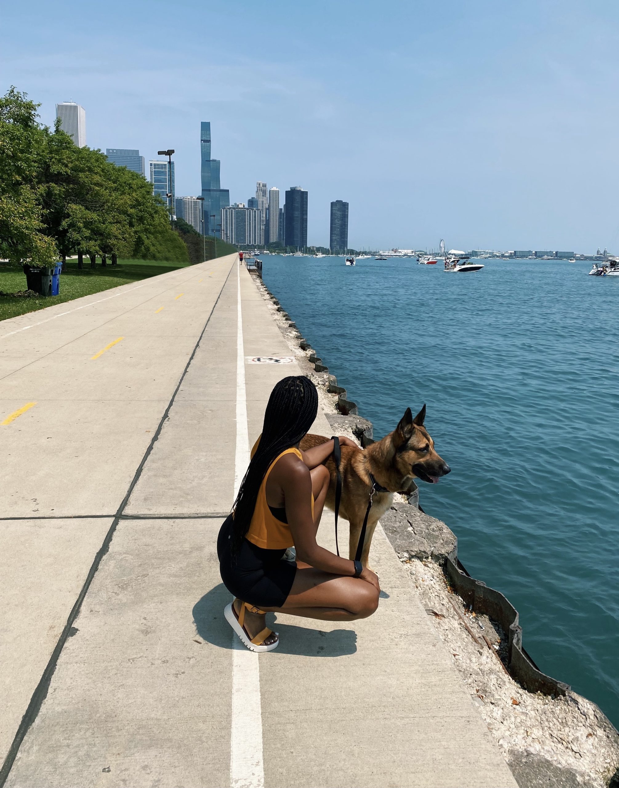 Lakeside Black Girl With Braids and Dog